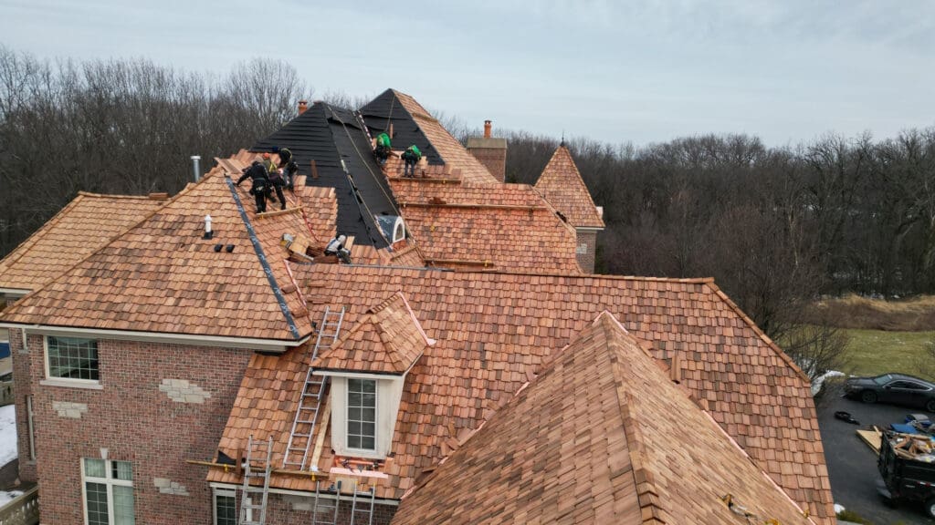 Roofing contractors installing cedar shake roofing in South Barrington